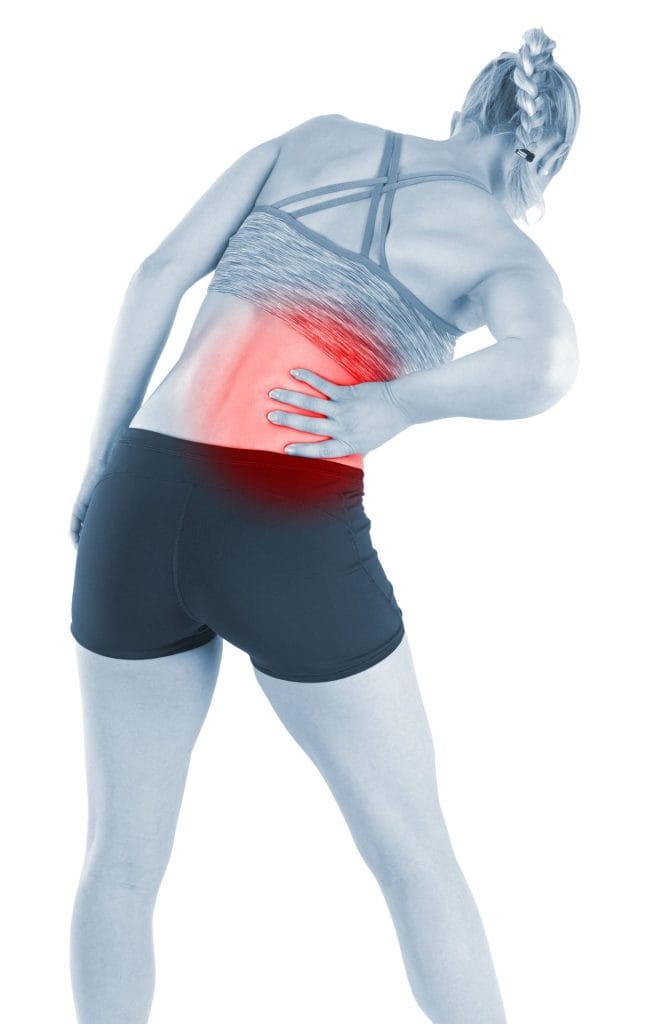 A woman feeling lower back pain while exercising, with the affected area highlighted in red to emphasize discomfort.
